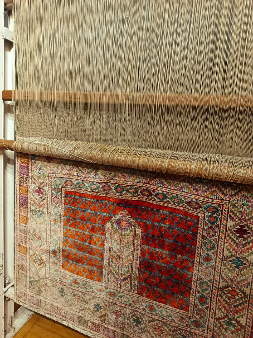 Old national carpet weaving loom in the exhibition section of the Museum of Applied Arts