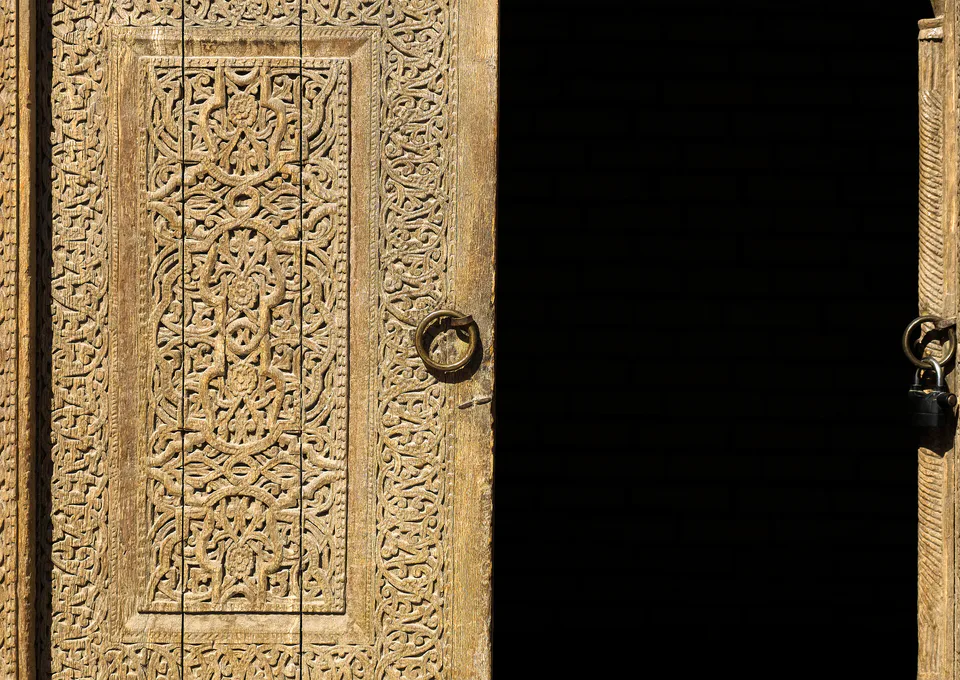 Carved doors in Said Mahruyjan Complex in Khiva, Uzbekistan