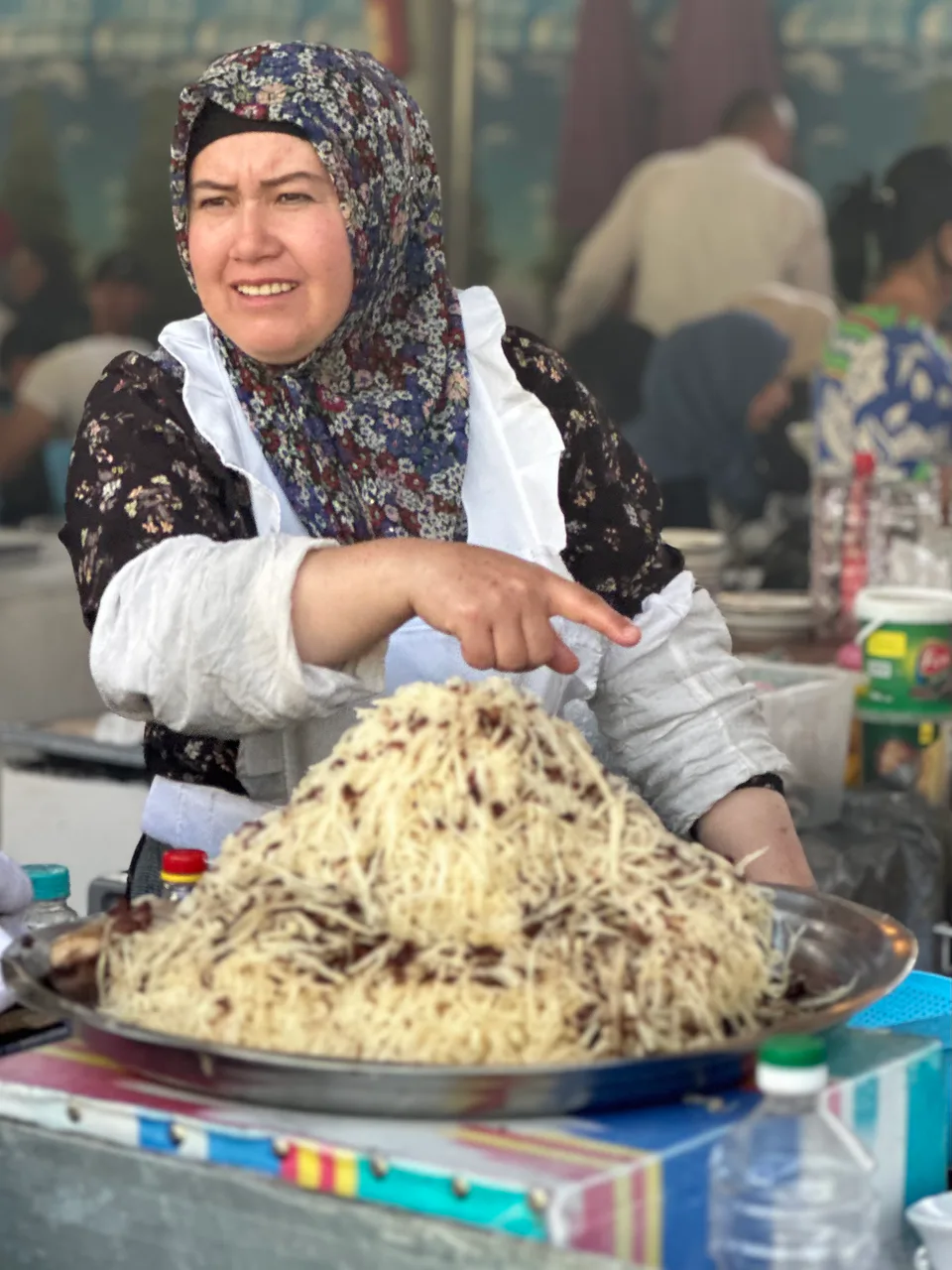 Woman in the Chorsu bazaar selling naryn. Tashkent, Uzbekistan, 2024.