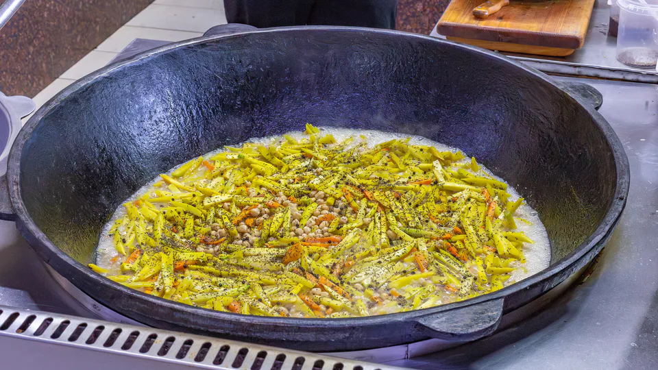 Cooking of pilaf at the Khadra cafe. Tashkent, Uzbekistan.