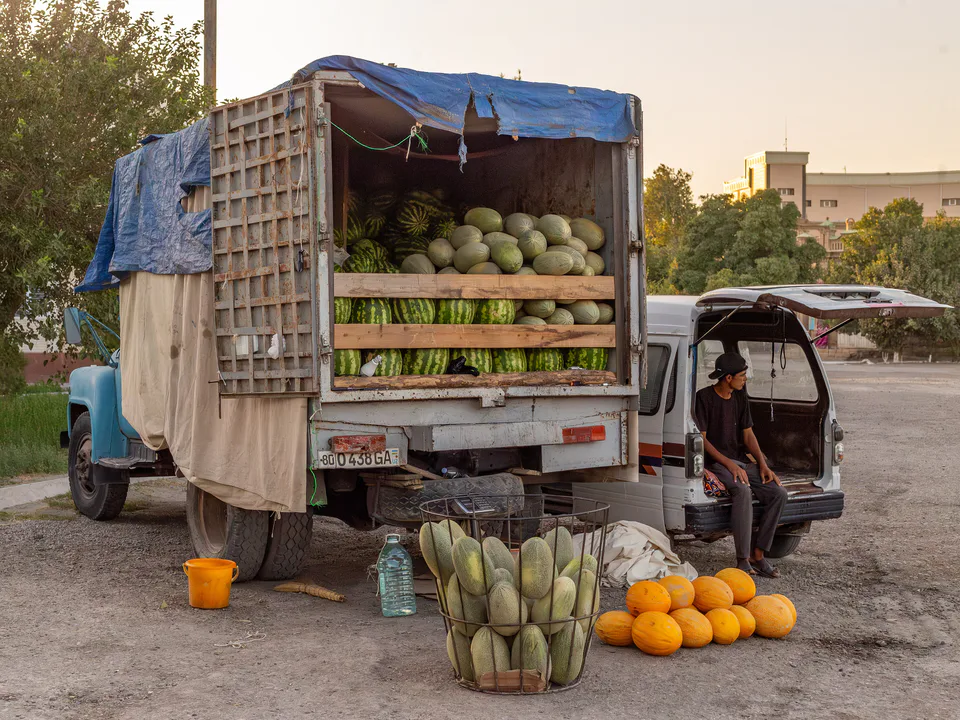 Melons for sale at the intersection of Madaniyat and Nurabad streets. Kagan, Bukhara Region, Uzbekistan.