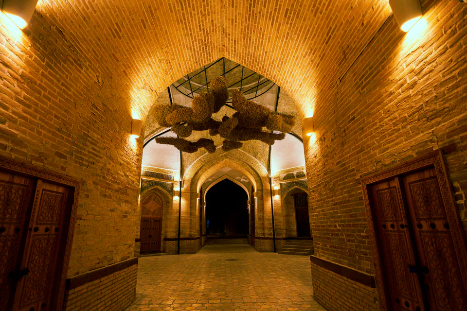 Exhibition view at Bukhara Biennial 2025, Bukhara, Uzbekistan. Photographed at night on 14 October 2025 by Khusen Rustamov.