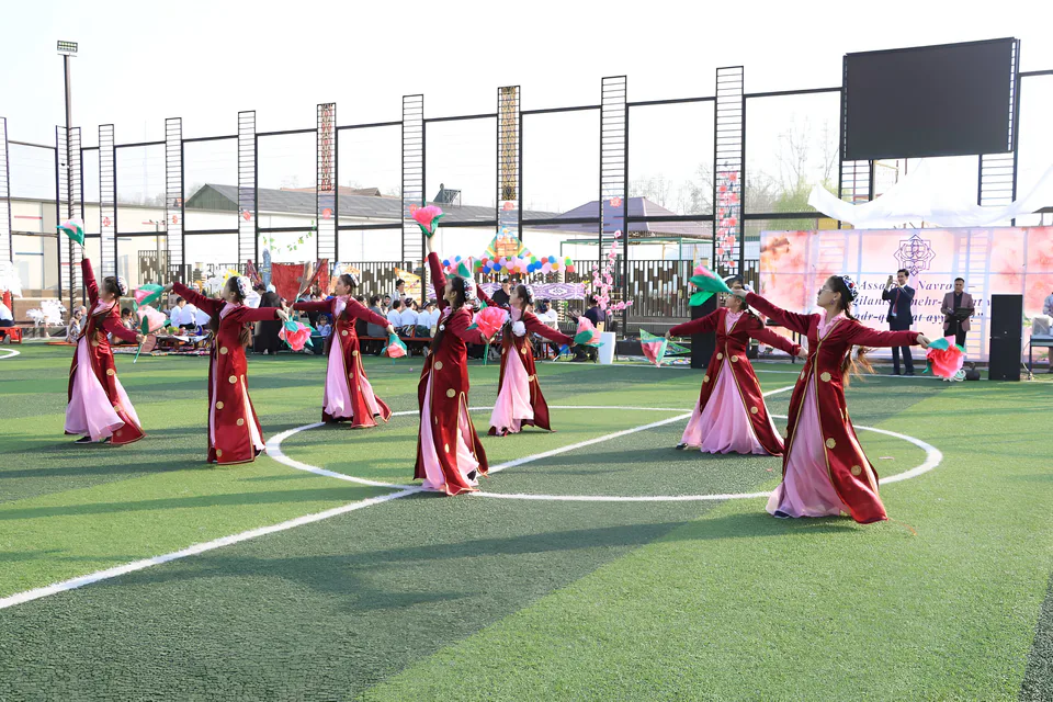 Girls performing a traditional Uzbek dance in "chopon" (coat) and "do‘ppi" (hat). This March 21 celebration marks the New Year in many cultures, welcoming spring, renewal, and new beginnings