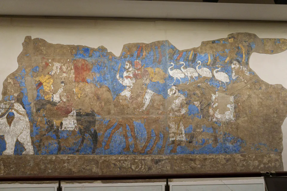Afrasiab murals at the Afrasiab Museum in Samarkand, Uzbekistan, May 2026. Dating to the 7th century, these ancient wall paintings depict diplomatic encounters and aspects of Sogdian court life, refle