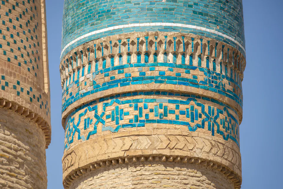 Tiled ornament at the top of minaret of Chor-minor medrese. Bukhara, Uzbekistan.