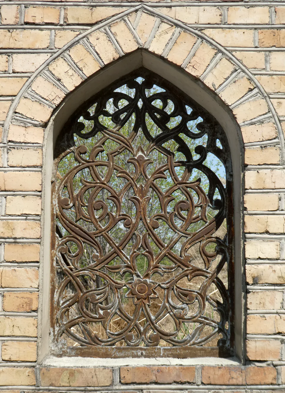 Window in the wall that hides Kokand Upper Mound (Tepa qoʻrgʻon) archaeological site, Uzbekistan