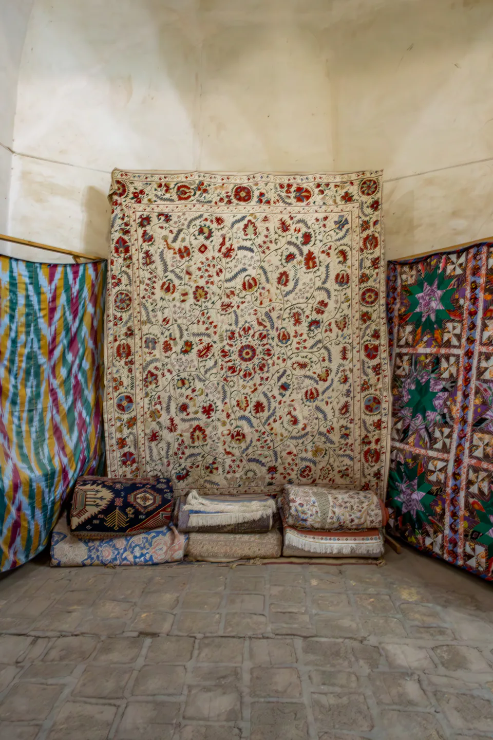 Rug on a wall in Tim of Abdullah Khan. Bukhara, Uzbekistan.