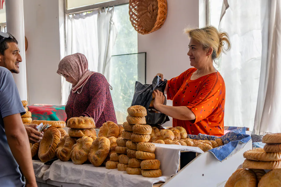 Fresh tandoor bread sold at the Chorsu market in Tashkent, Uzbekistan, August 2025.