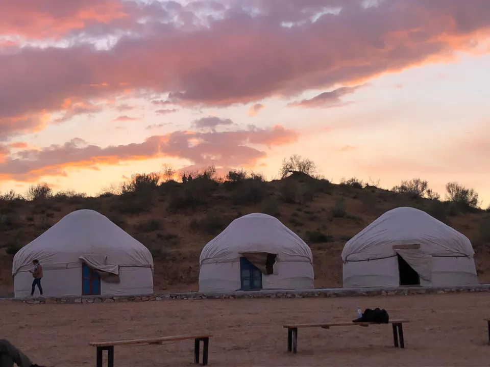 The sun setting over the yurts on the Kyzylkum safari