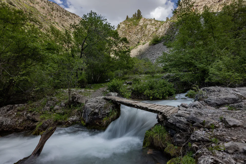 Wooden bridge across Ispay river. Tashkent Region, Uzbekistan.